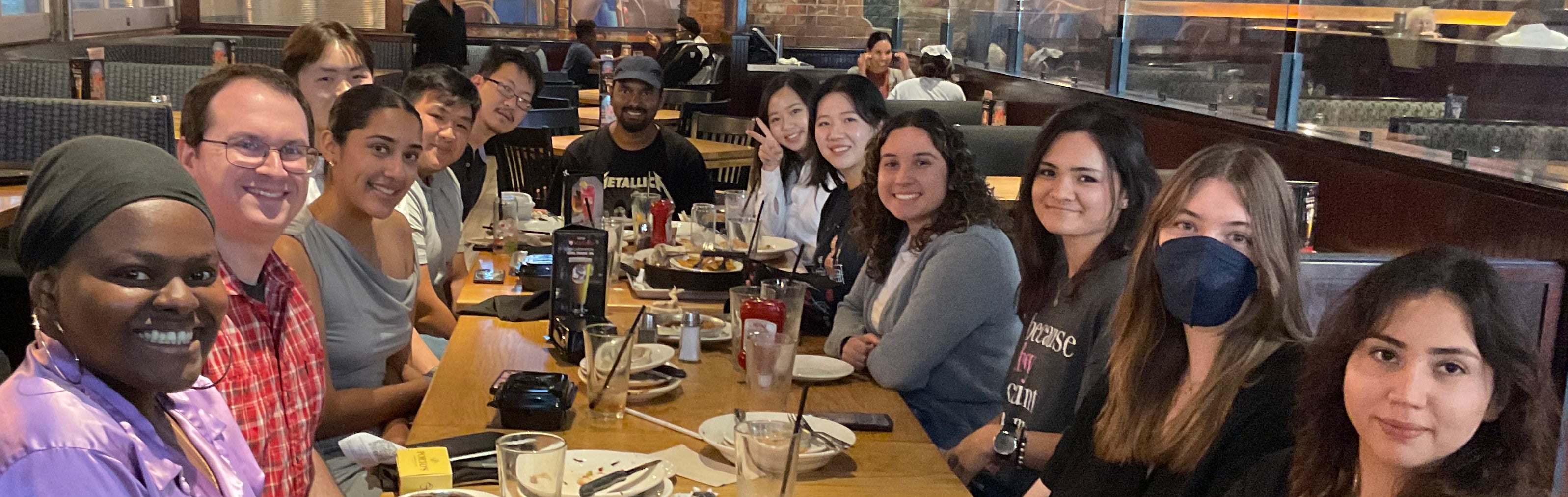 Picture of Genereux Lab Group Members eating lunch in Summer 2024